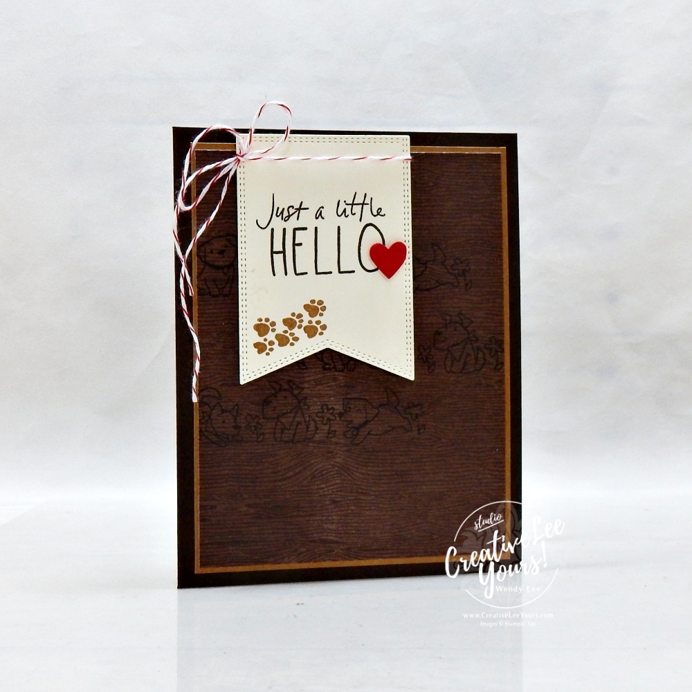 handmade card with neutral tones and stamped puppy background