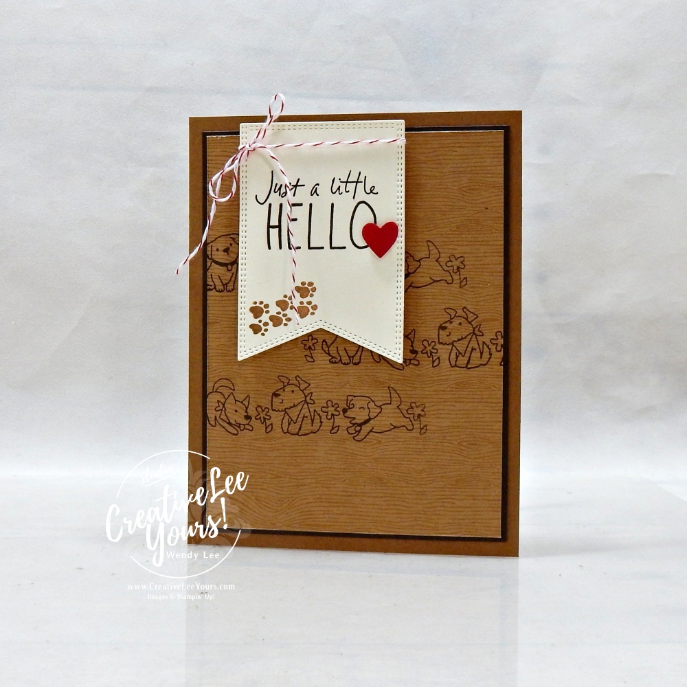 handmade card with neutral tones and stamped puppy background