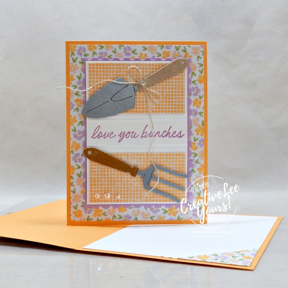 handmade card using scrap paper strips with floral pattern and garden tools embellishments