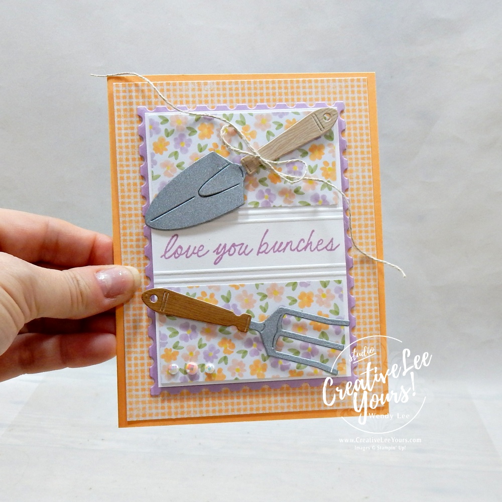 handmade card using scrap paper strips with floral pattern and garden tools embellishments