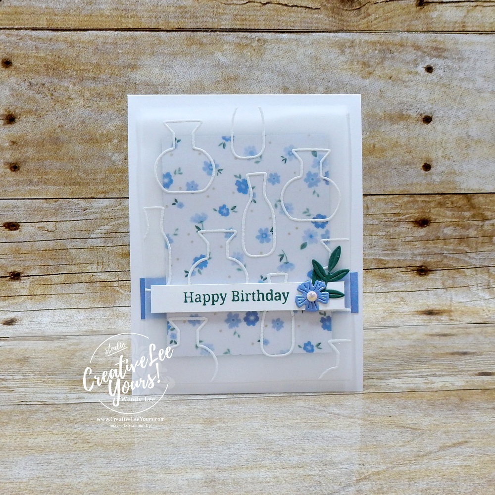 Elegant handmade card with embossed vellum overlay, floral DSP background, and layered sentiment strip on white card base
