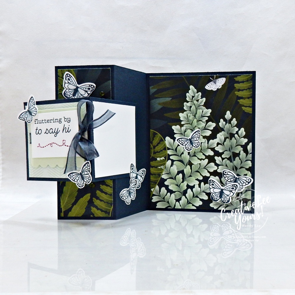 Interactive butterfly fun fold card opened to reveal layered floral design and dimensional butterflies