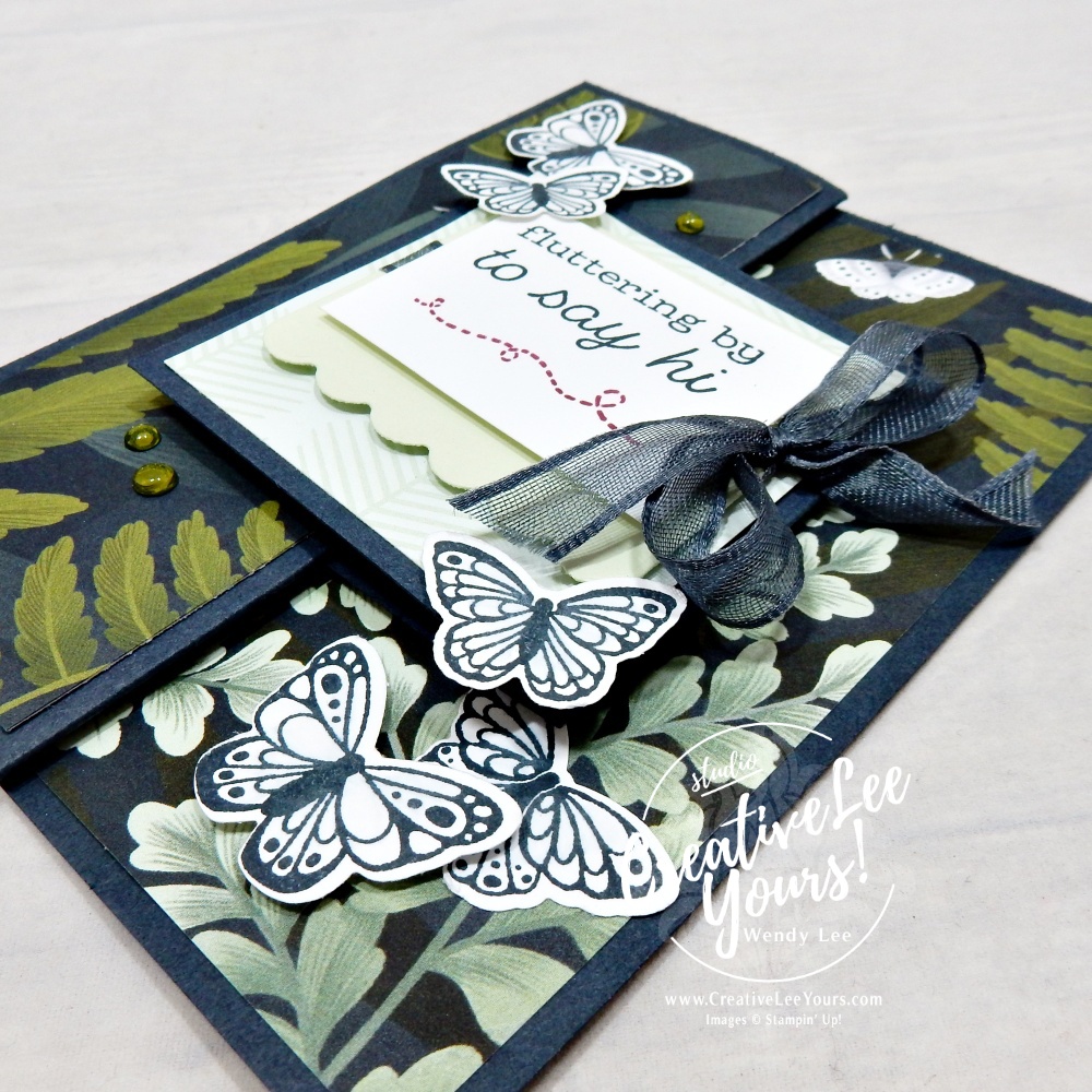 Close-up of handmade butterfly card featuring Secret Sea cardstock, layered butterflies, and sparkle accents