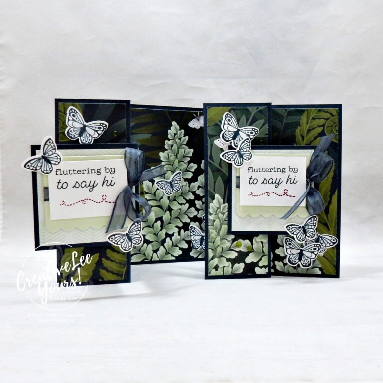 Interactive butterfly fun fold card opened to reveal layered floral design and dimensional butterflies