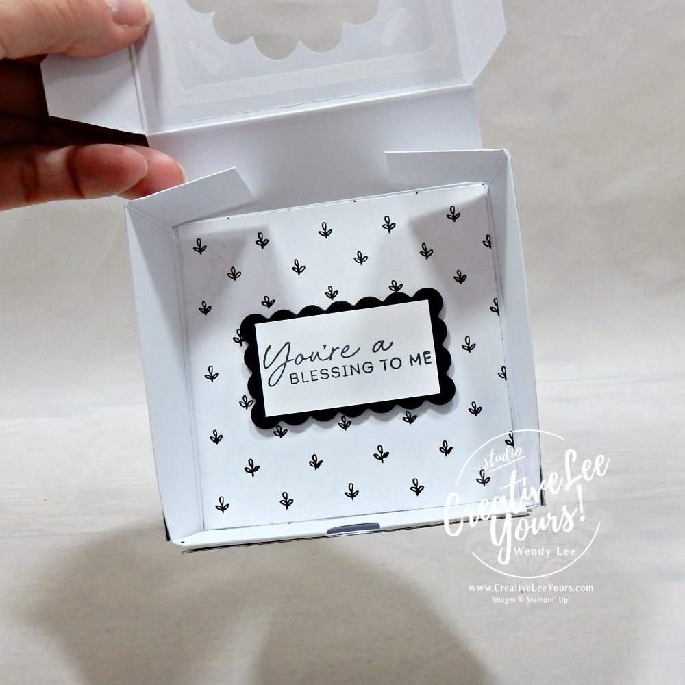 Handmade scalloped window gift box opened to reveal decorative interior details and floral accents