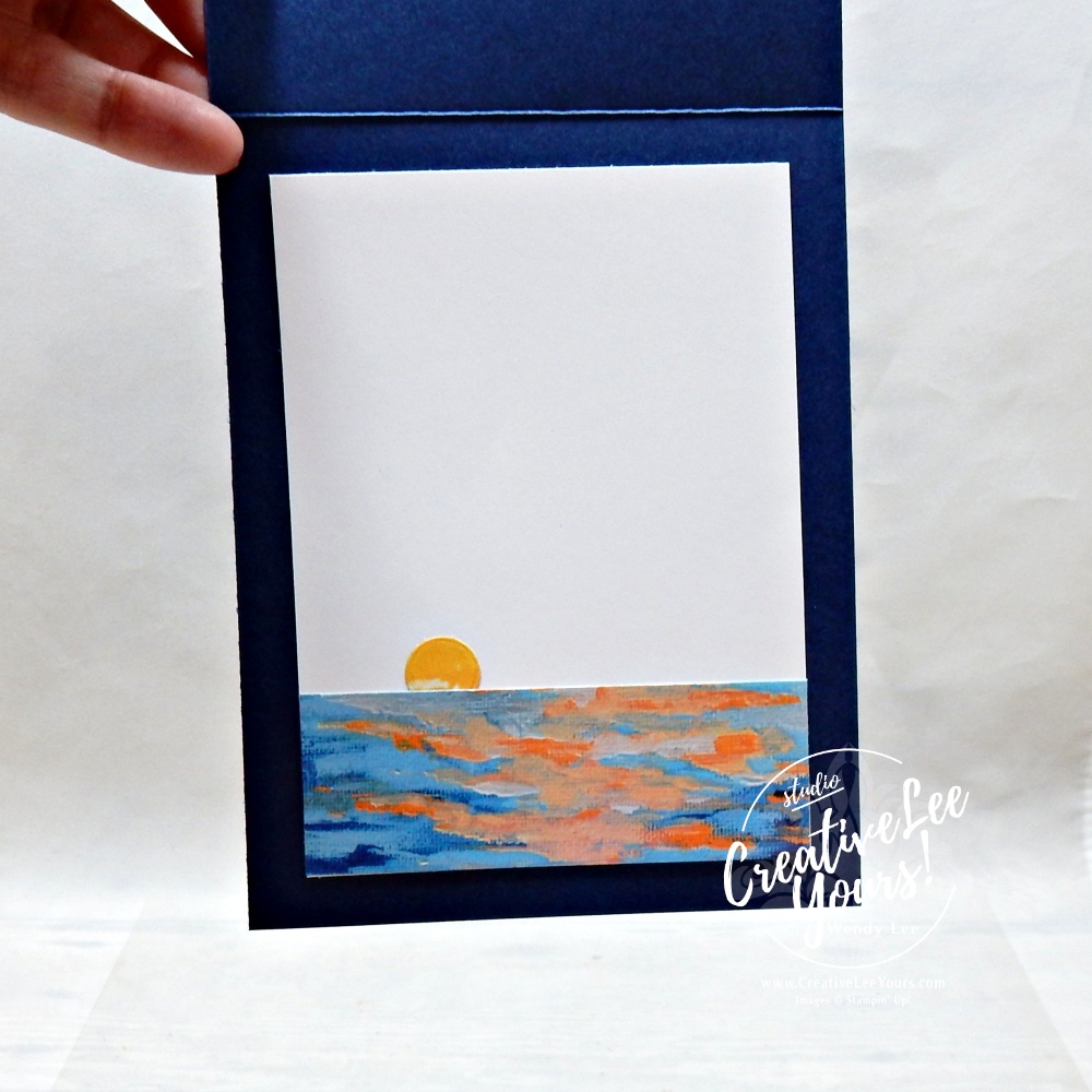 Inside of handmade Sunset Coast card showing coordinating sunset designer paper strip and die-cut sun accent on a navy card base.
