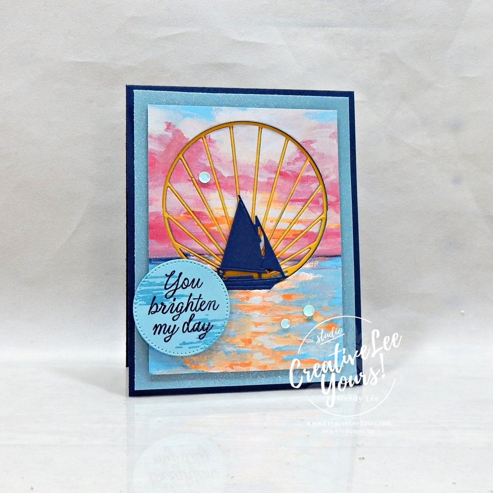 Handmade Sunset Coast card featuring Scenic Coast designer paper, shimmer vellum, inlaid sun ray die cut, sailboat silhouette, and You Brighten My Day sentiment.