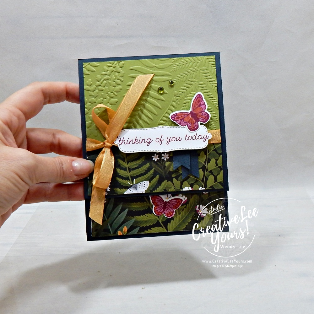 Closed Vertical Z Fold butterfly card featuring Moonlit Flora Designer Series Paper, embossed Old Olive panel, ribbon, punched butterflies, and Berry Burst stamped sentiment.