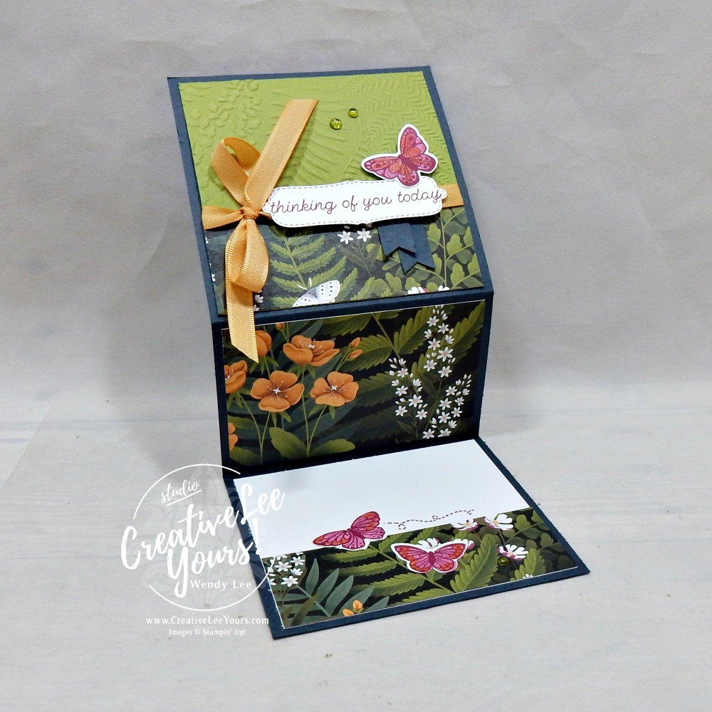 Open Vertical Z Fold handmade butterfly card showing continuous floral designer paper across the fold with stamped butterflies and writing space inside.