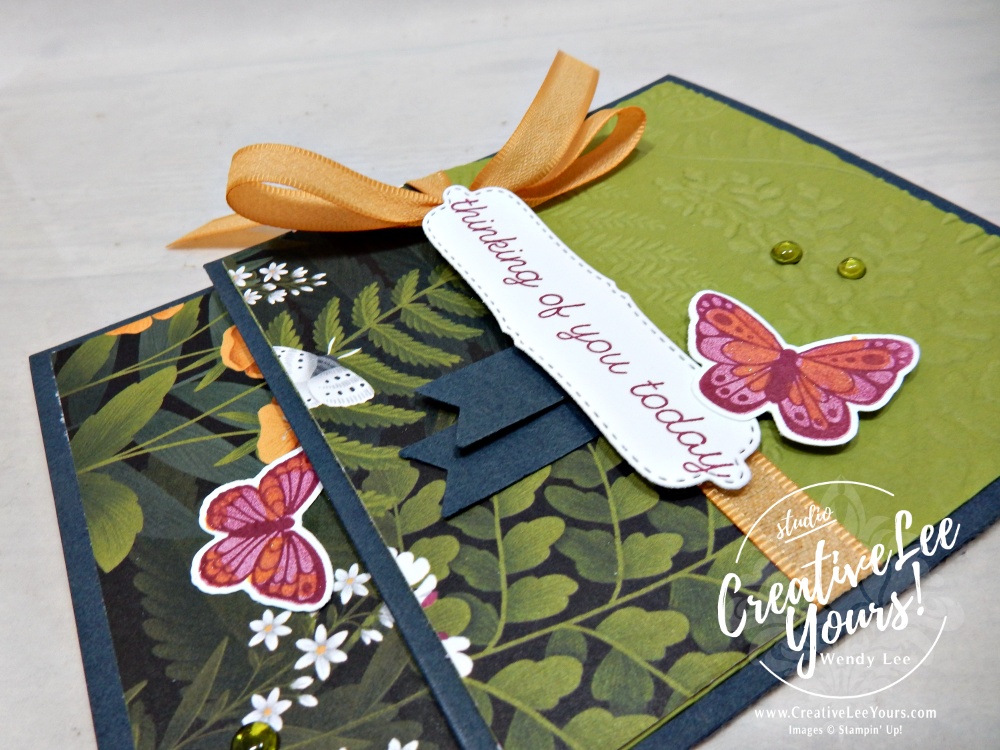 Close-up of hand-stamped butterflies colored using stamped-off Berry Burst ink and accented with Golden Glow shimmer.