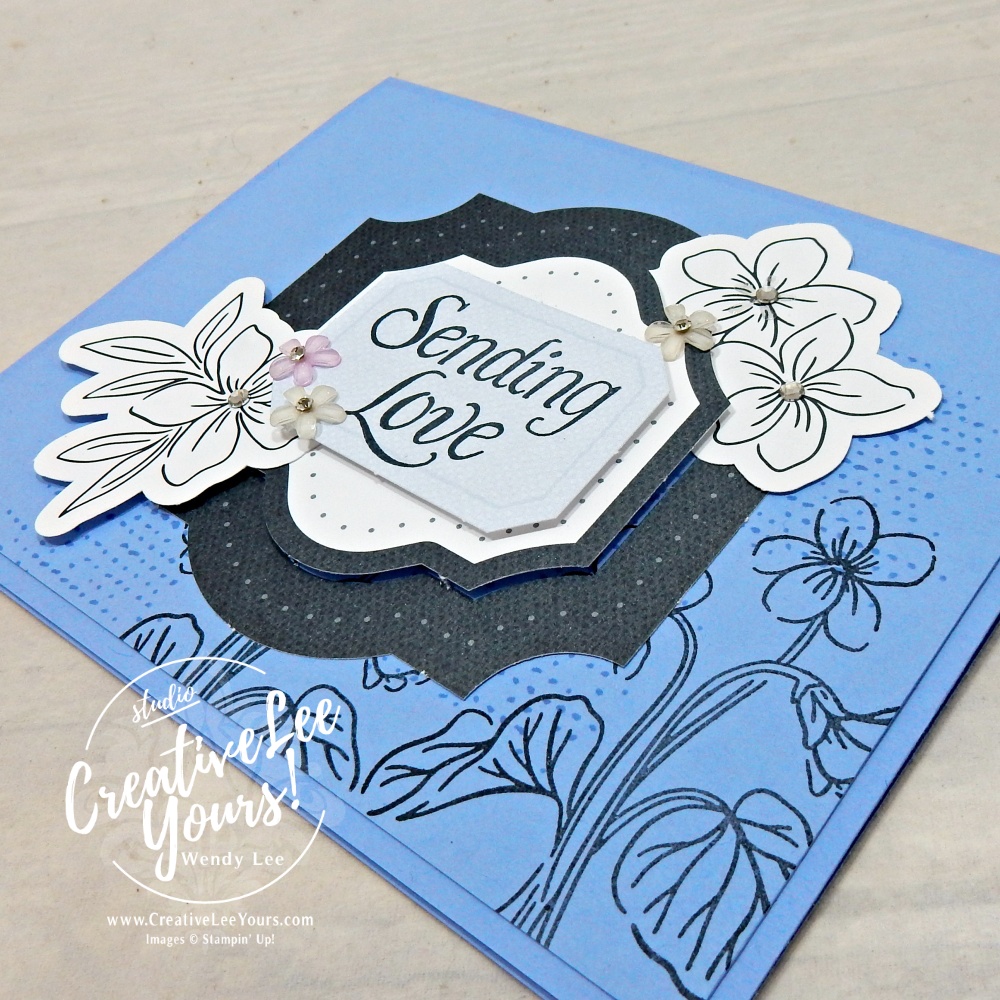Close-up of layered floral ephemera, die cuts and sparkling details on easy handmade card