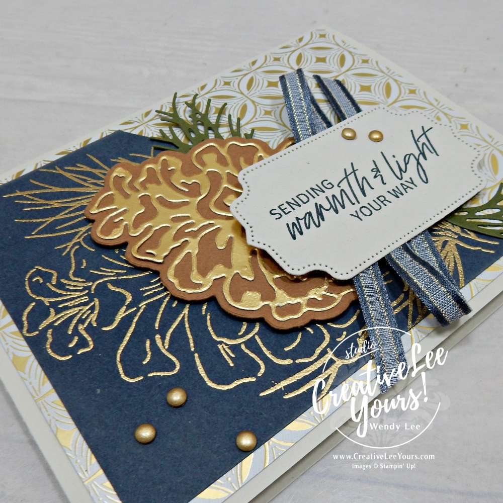 Close-up of gold pinecone, ribbon and layered details on an elegant Frosted Pinecones handmade card
